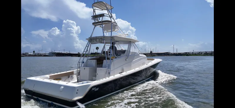 Slide: The Image of 2015 SeaVee 43 Fish-Around boat cruising on a sunny day. - 36