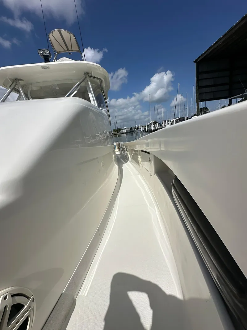 Slide: The Image of 2015 SeaVee 43 Fish-Around boat deck under clear blue sky. - 40