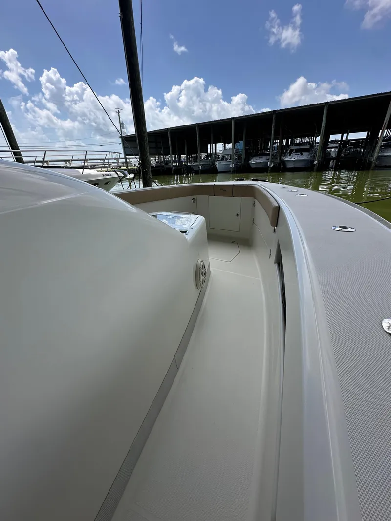 Slide: The Image of 2015 SeaVee 43 Fish-Around boat docked under a clear blue sky. - 48
