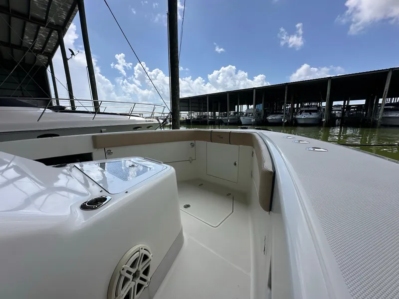 Slide: The Image of 2015 SeaVee 43 Fish-Around boat docked under a clear blue sky. - 49