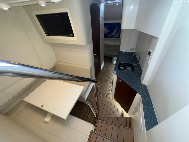 Slide: The Image of Interior of 2015 SeaVee 43 Fish-Around boat with modern kitchen and seating area. - 62