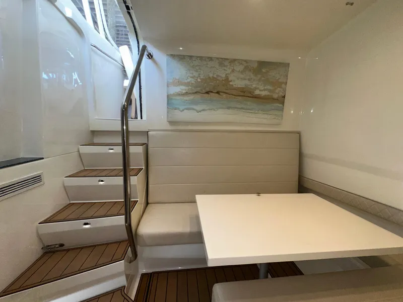 Slide: The Image of Interior of 2015 SeaVee 43 Fish-Around with seating and table, featuring modern design. - 67