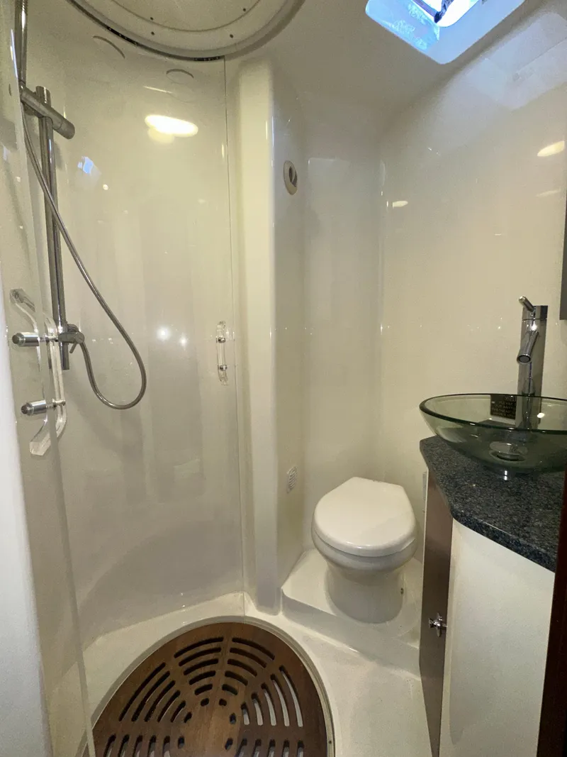 Slide: The Image of 2015 SeaVee 43 Fish-Around bathroom with shower, toilet, and glass sink. - 69