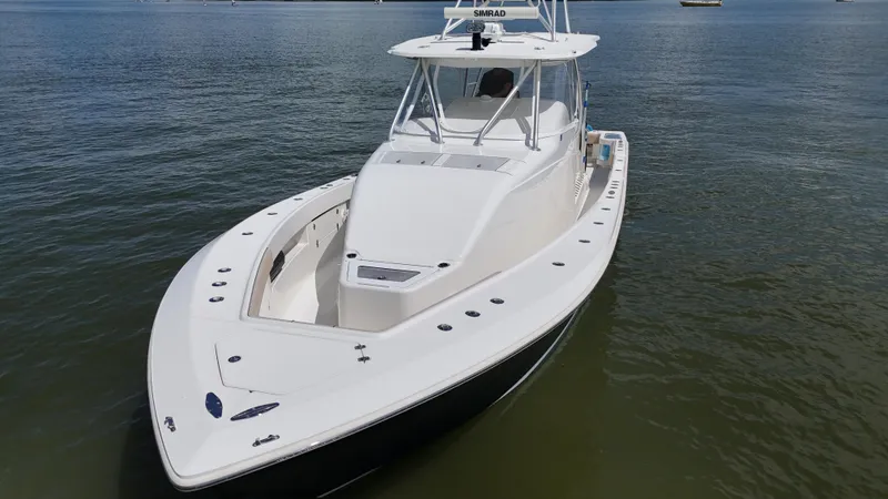 Slide: The Image of 2015 SeaVee 43 Fish-Around boat on calm water, aerial view. - 7