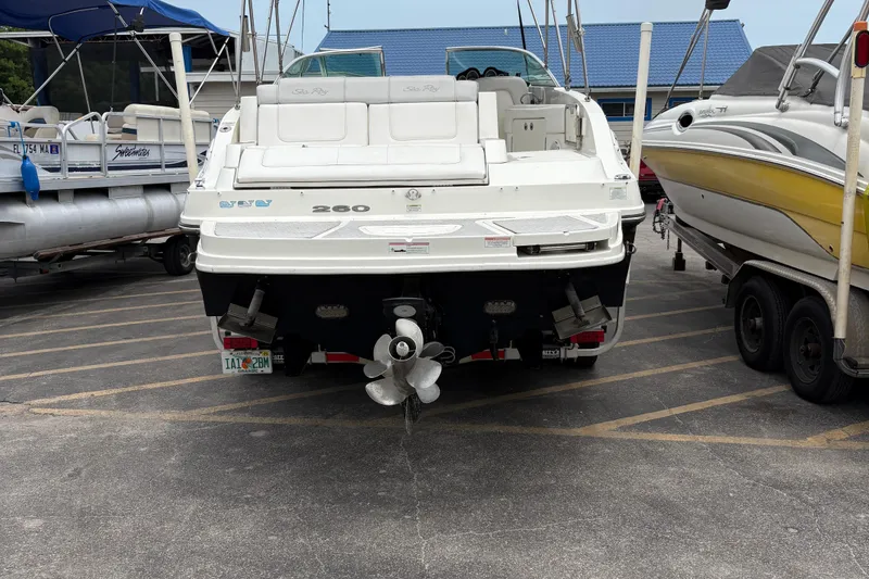 Slide: The Image of 2012 Sea Ray 260 Sundeck boat, rear view, parked in a marina. - 11