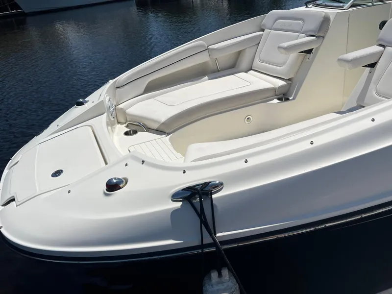 Slide: The Image of 2012 Sea Ray 260 Sundeck boat with white seating and sleek design. - 28