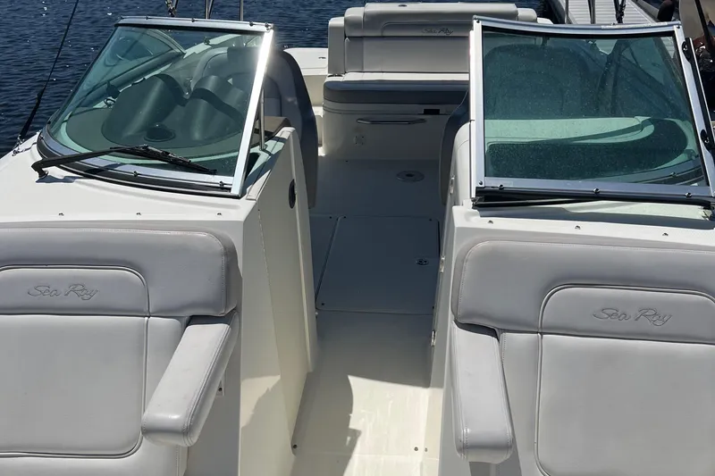 Slide: The Image of 2012 Sea Ray 260 Sundeck boat interior with seating and windshields. - 39
