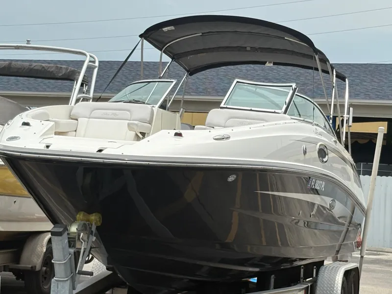 Slide: The Image of 2012 Sea Ray 260 Sundeck boat on trailer, featuring sleek design and spacious seating. - 5