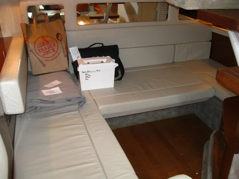 Slide: The Image of Interior of 2011 Sea Ray 350 Sundancer with seating and storage items. - 41