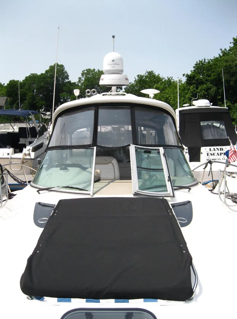 Slide: The Image of 2011 Sea Ray 350 Sundancer yacht docked, featuring sleek design and modern amenities. - 8