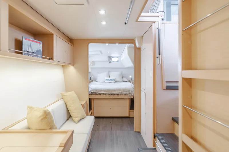Slide: The Image of Luxurious interior of 2016 Lagoon 450F catamaran, featuring cozy seating and elegant bedroom. - 34