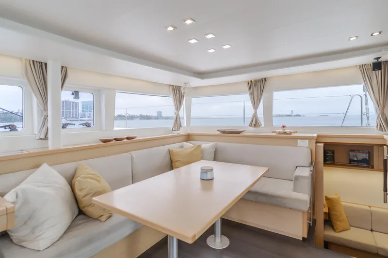 Slide: The Image of Interior of 2016 Lagoon 450F catamaran with spacious seating and panoramic windows. - 38
