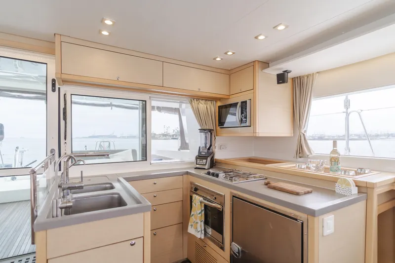 Slide: The Image of Modern kitchen interior of 2016 Lagoon 450F catamaran with appliances and sea view. - 40