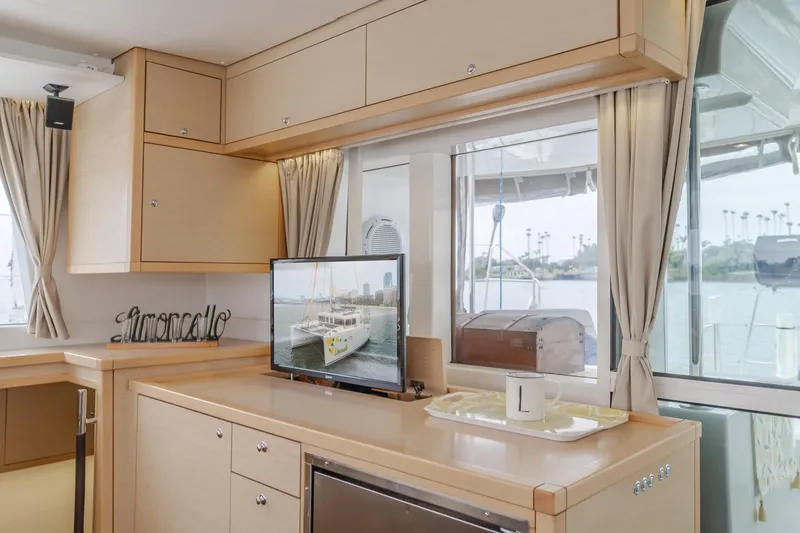 Slide: The Image of Interior of 2016 Lagoon 450F yacht with modern kitchen and scenic window view. - 43