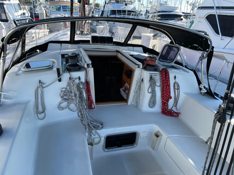 Slide: The Image of Sailboat cockpit of 2001 C&C 121 with ropes and equipment, docked at marina. - 16