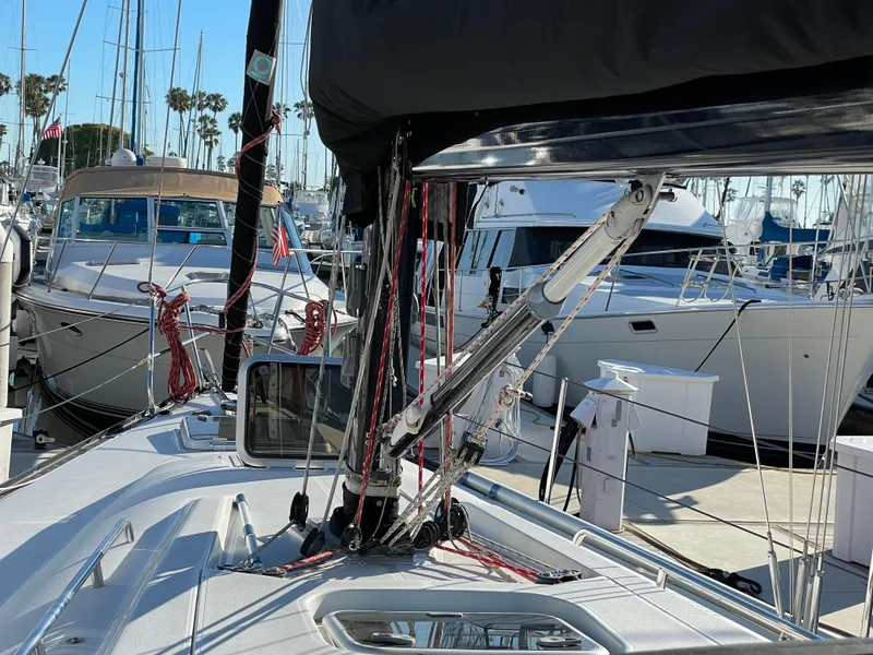 Slide: The Image of Sailboat deck view at marina, featuring C&C 121 model from 2001. - 17