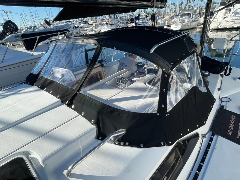 Slide: The Image of Sailboat C&C 121 (2001) with black canvas cover in marina setting. - 20