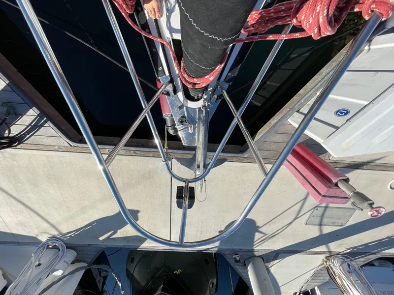 Slide: The Image of Top view of a 2001 C&C 121 sailboat docked, showing mast and rigging. - 23