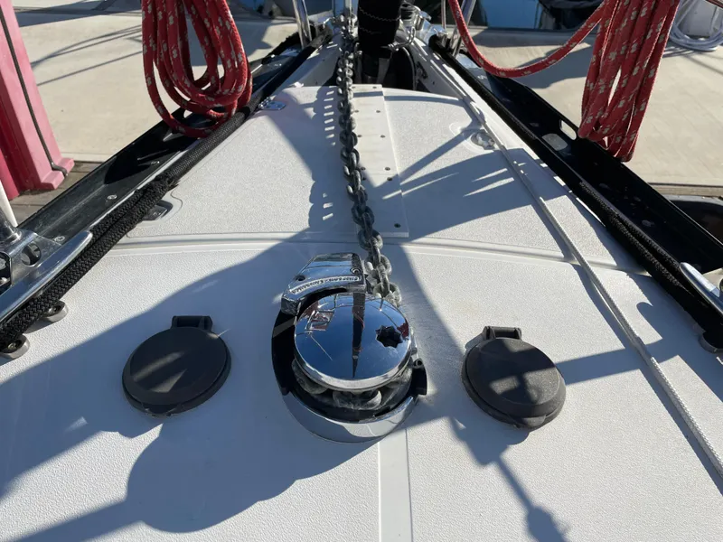Slide: The Image of Deck of 2001 C&C 121 sailboat with anchor chain and red ropes. - 24