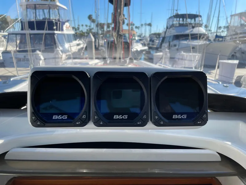 Slide: The Image of B&G marine instruments on a C&C 121 yacht, docked at a marina, 2001 model. - 27
