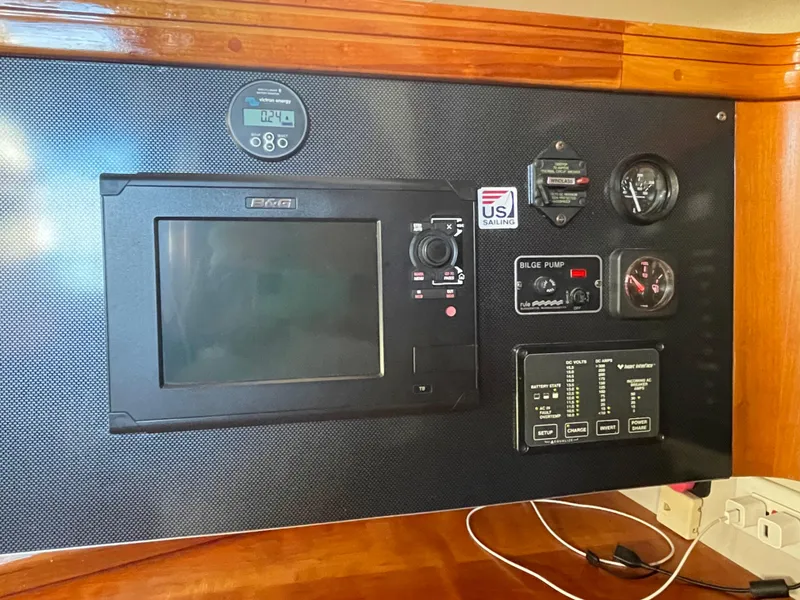 Slide: The Image of Control panel of a 2001 C&C 121 yacht with navigation and monitoring instruments. - 39