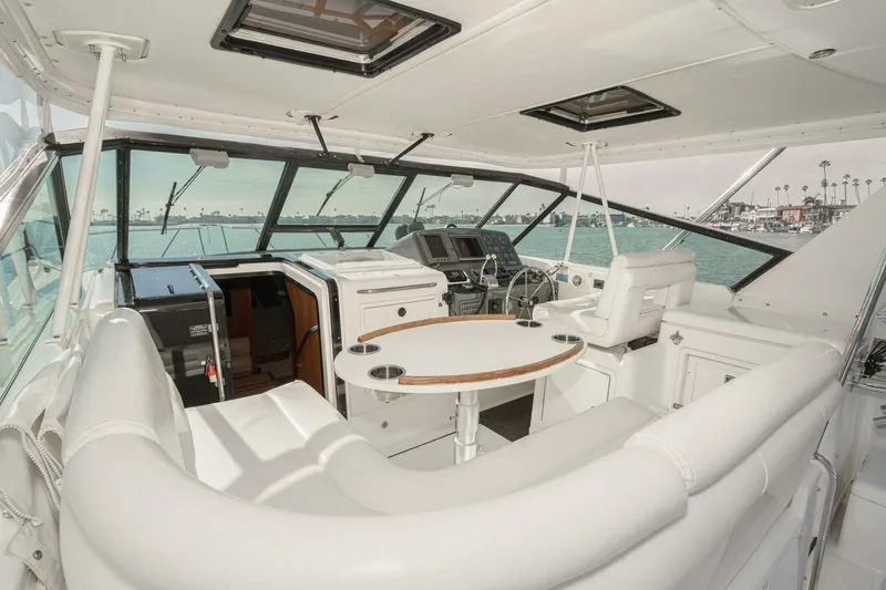 Slide: The Image of 2002 Tiara Yachts 4100 Open interior with helm, seating, and ocean view. - 12
