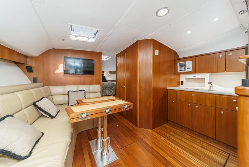 Slide: The Image of Luxurious interior of 2002 Tiara Yachts 4100 Open, featuring wood finishes and modern amenities. - 23