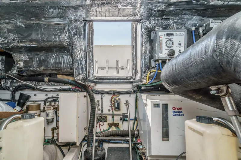 Slide: The Image of Engine room of 2002 Tiara Yachts 4100 Open with Onan Marine GenSet. - 34