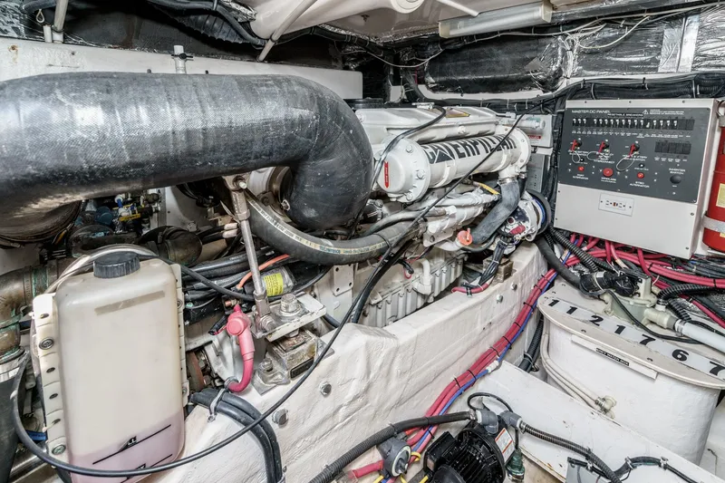 Slide: The Image of Engine room of a 2002 Tiara Yachts 4100 Open, showcasing mechanical components and wiring. - 36