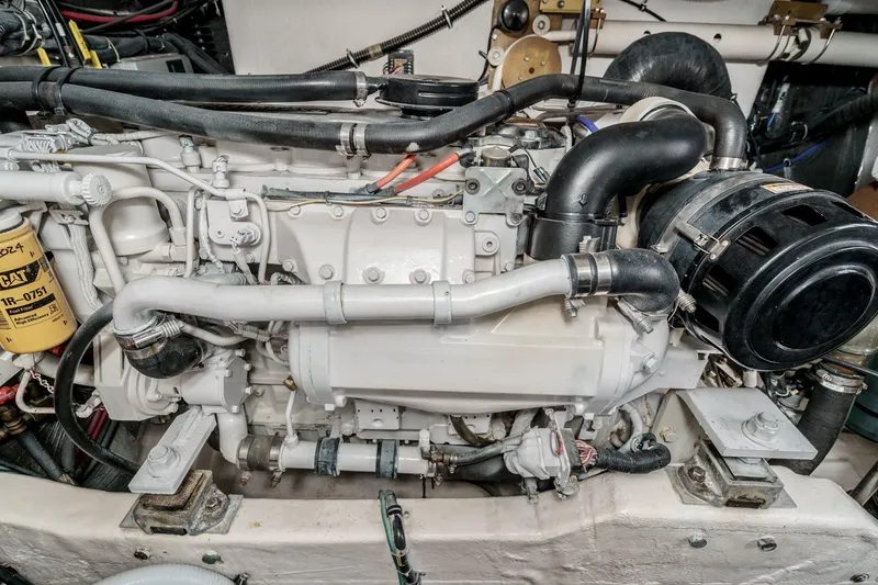 Slide: The Image of Engine of a 2002 Tiara Yachts 4100 Open, showcasing detailed mechanical components. - 37