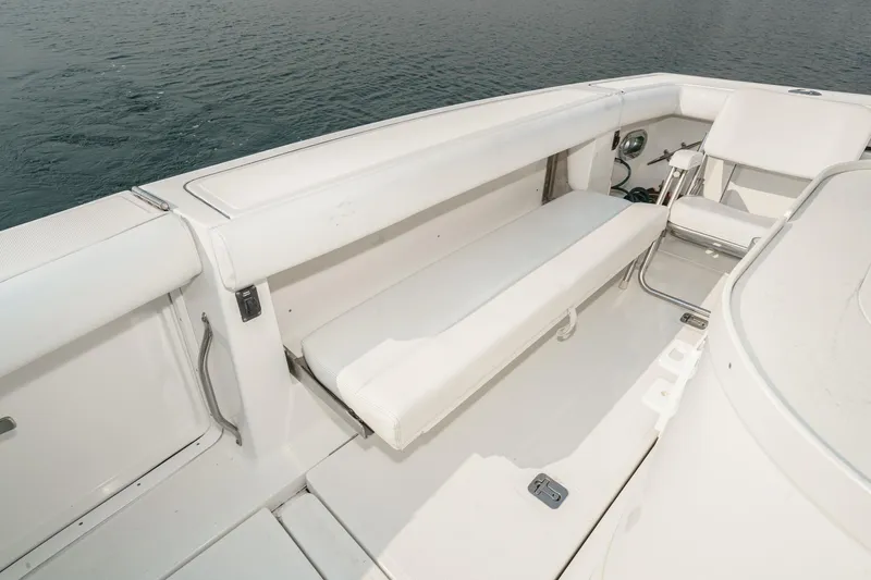 Slide: The Image of 2002 Tiara Yachts 4100 Open boat interior with white seating and ocean backdrop. - 46