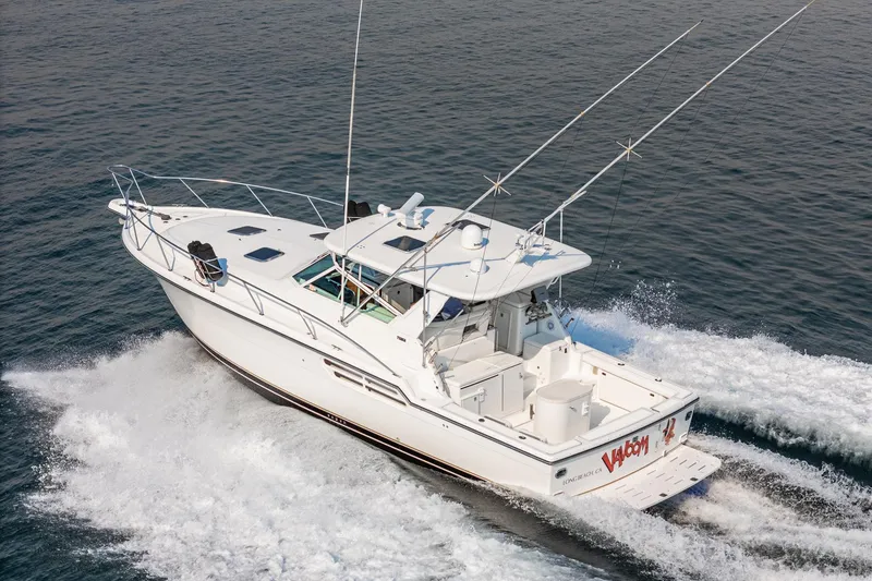Slide: The Image of 2002 Tiara Yachts 4100 Open cruising on water, aerial view. - 7