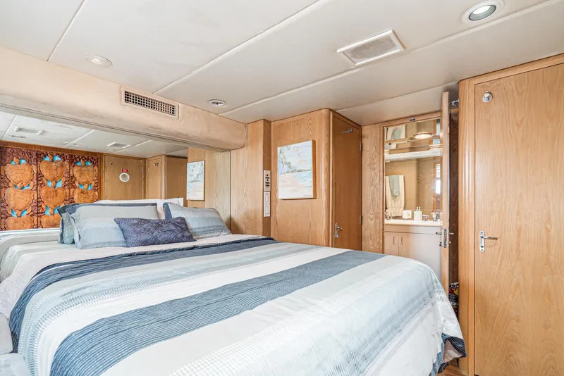 Slide: The Image of Luxurious bedroom in 1996 Hatteras 70 Sport Deck Motor Yacht with ensuite bathroom. - 30