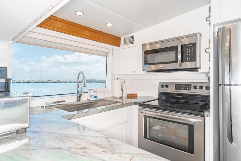 Slide: The Image of Modern kitchen in 1996 Hatteras 70 Sport Deck Motor Yacht with ocean view. - 34