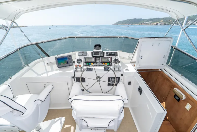 Slide: The Image of Cockpit of 1996 Hatteras 70 Sport Deck Motor Yacht with ocean view. - 42