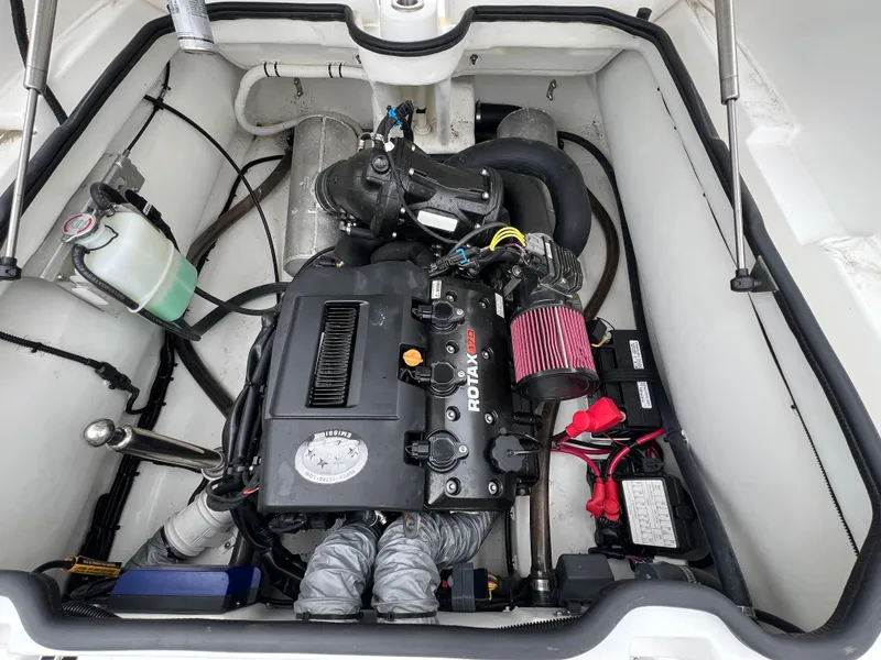 Slide: The Image of Engine compartment of 2023 AB Inflatables ABJET 430XP, featuring a Rotax engine. - 13