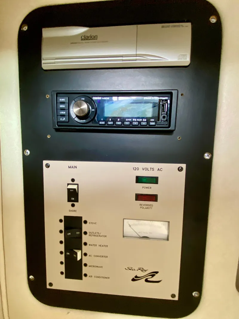 Slide: The Image of Control panel of a 2001 Sea Ray 290 Bowrider with stereo and electrical switches. - 19