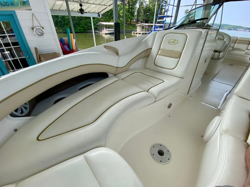 Slide: The Image of 2001 Sea Ray 290 Bowrider interior with white leather seating and spacious layout. - 26