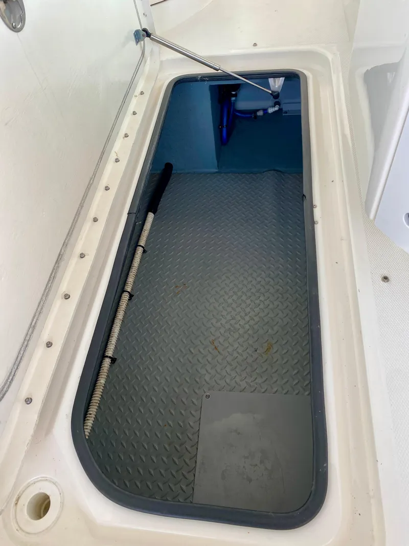 Slide: The Image of Storage compartment of a 2001 Sea Ray 290 Bowrider boat, featuring a spacious interior. - 5