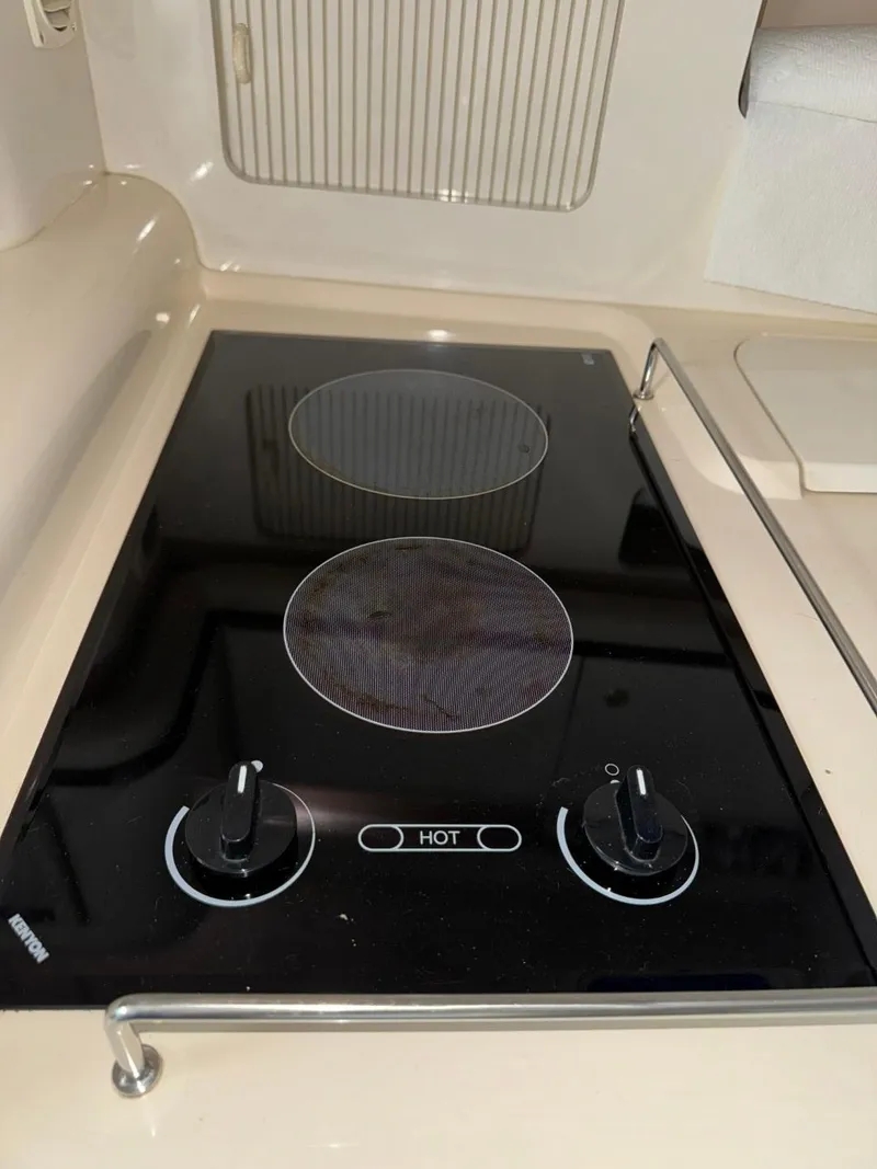 Slide: The Image of Electric stove in 1997 Sea Ray 330 Sundancer yacht kitchen area. - 21