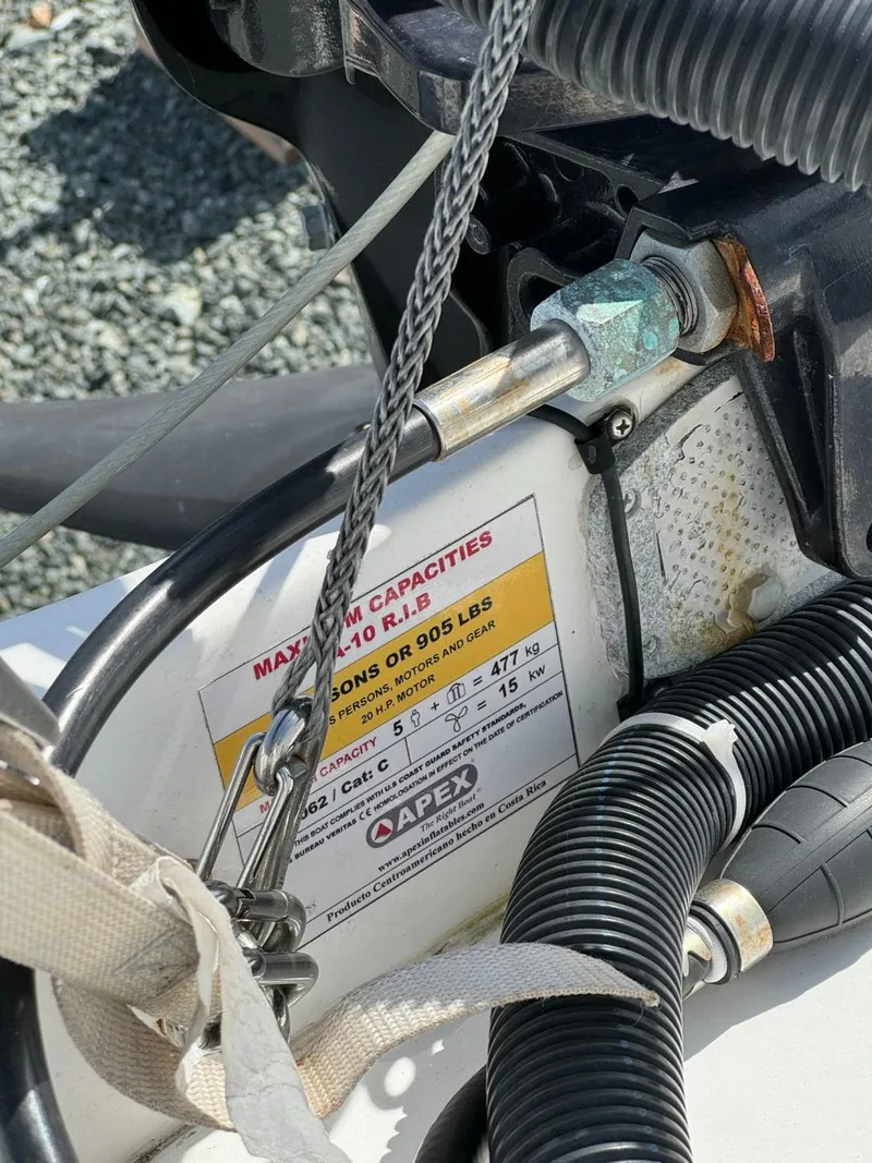 Slide: The Image of Close-up of a 1997 Sea Ray 330 Sundancer boat's engine compartment with capacity label. - 3