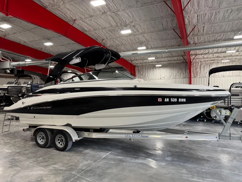 Slide: The Image of 2015 Crownline Eclipse E4 boat on trailer in warehouse. - 1