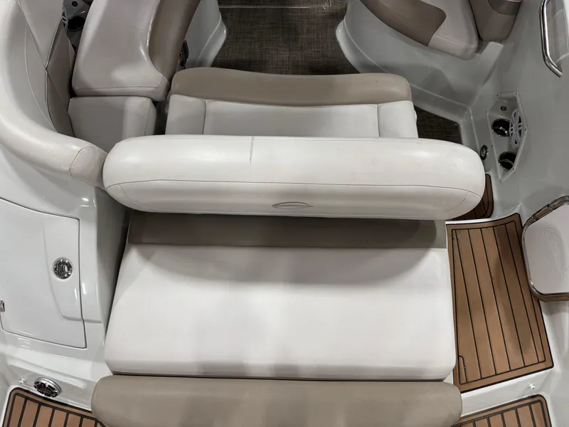 Slide: The Image of Interior of a 2015 Crownline Eclipse E4 boat with beige seating. - 12