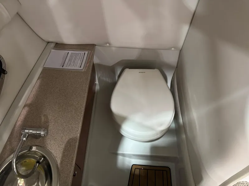 Slide: The Image of Interior of a 2015 Crownline Eclipse E4 with toilet. - 13