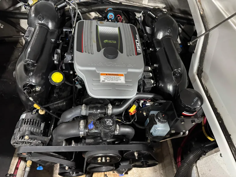 Slide: The Image of Engine of a 2015 Crownline Eclipse E4 boat, close-up view. - 14