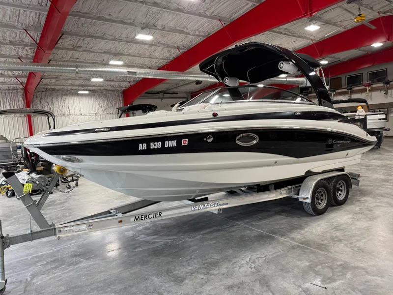 Slide: The Image of 2015 Crownline Eclipse E4 boat on trailer in warehouse. - 2