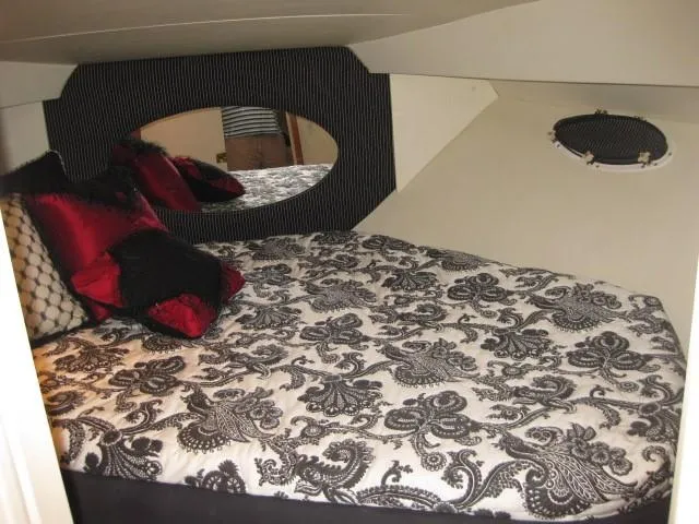 Slide: The Image of Green underwater light illuminating water near docked 1999 Silverton 352 Motor Yacht. - 11