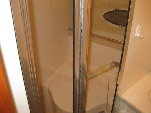 Slide: The Image of Interior of a 1999 Silverton 352 Motor Yacht with cozy seating and modern amenities. - 15