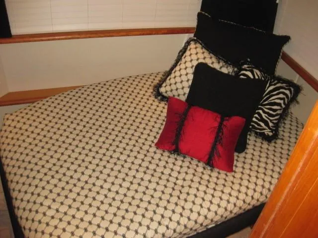 Slide: The Image of Bathroom interior of a 1999 Silverton 352 Motor Yacht, featuring sink and shower. - 16