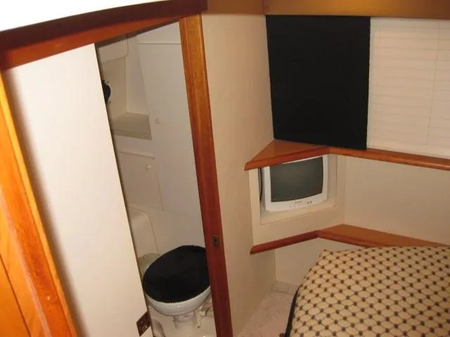 Slide: The Image of Bathroom interior of 1999 Silverton 352 Motor Yacht with sink and toilet. - 17